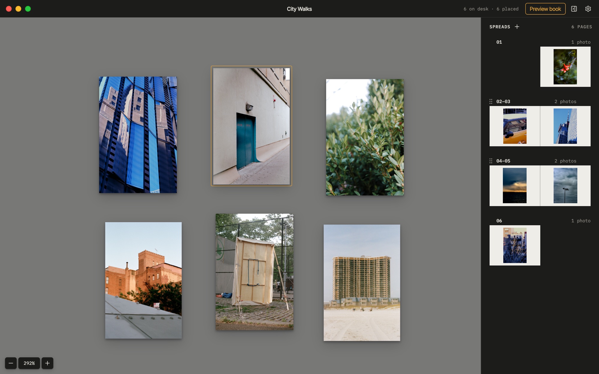 The desk: photos spread out, with the book's spreads in the sidebar